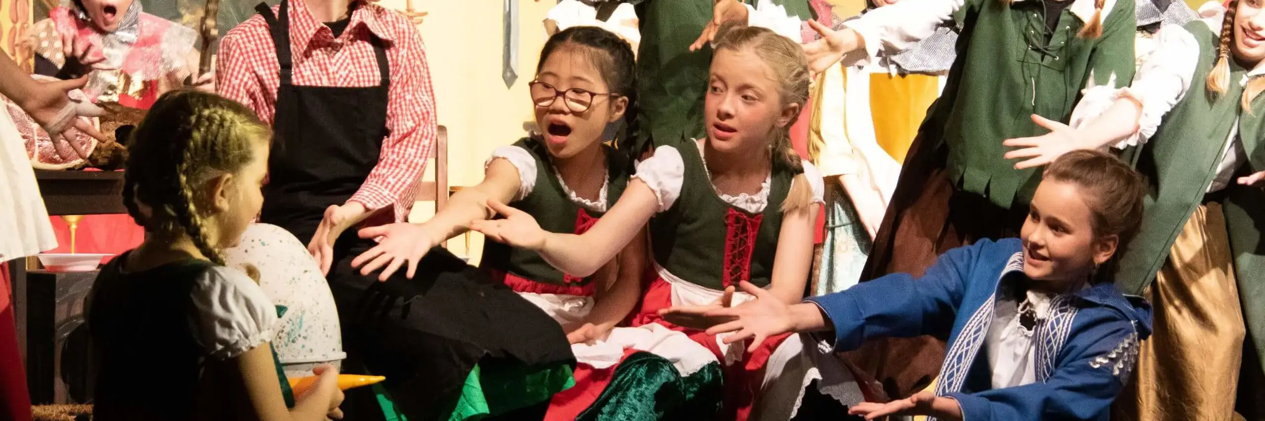 ISD Elementary School pupils performing in a theatre production.