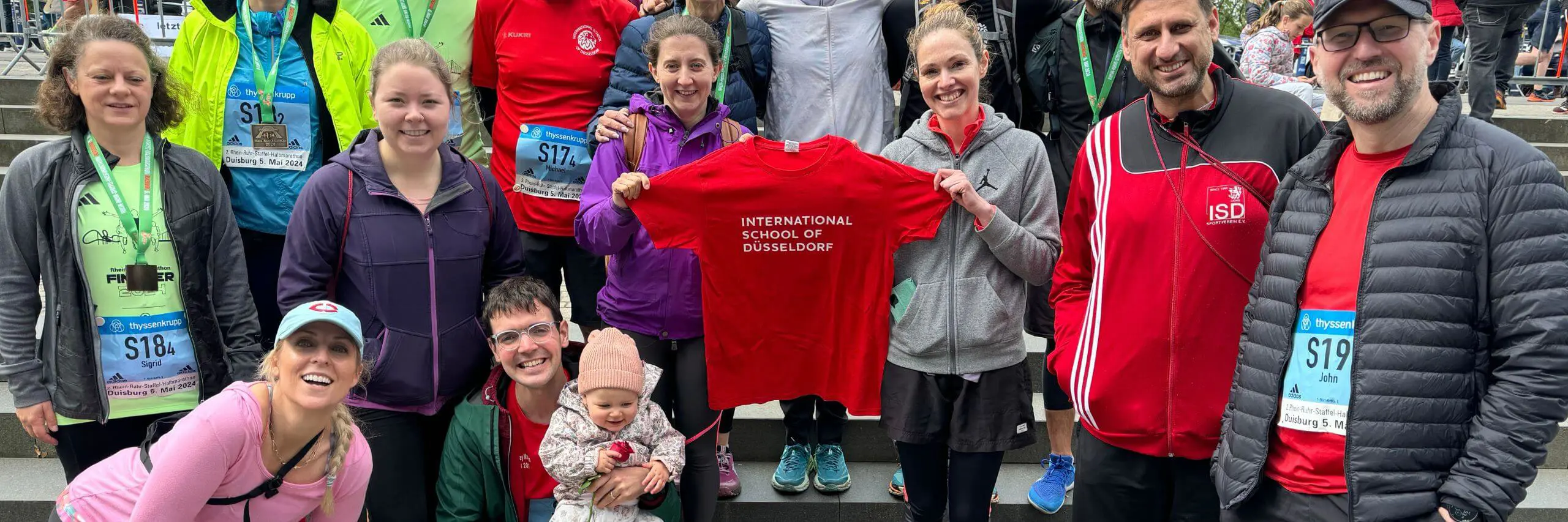 ISD parents and teachers with ISD t-shirt.