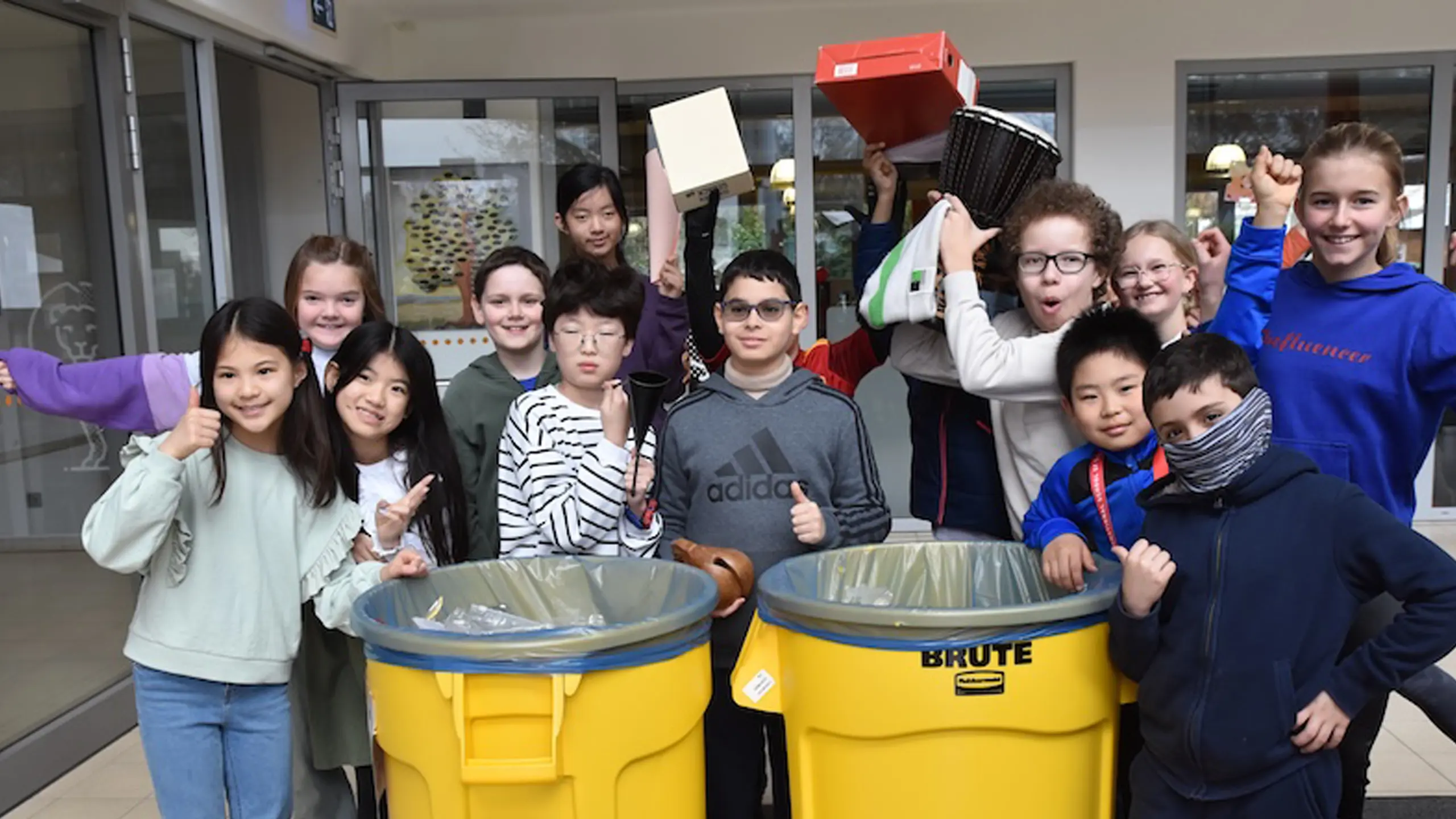 Elementary students enjoying the weekly recycling initiative known as Yellow Bin Pick-Up Time (YBPT).