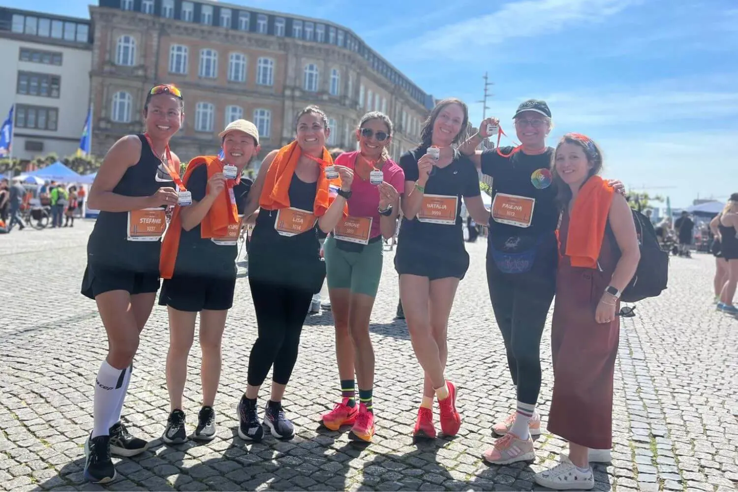 ISD Parents with medals from community run.