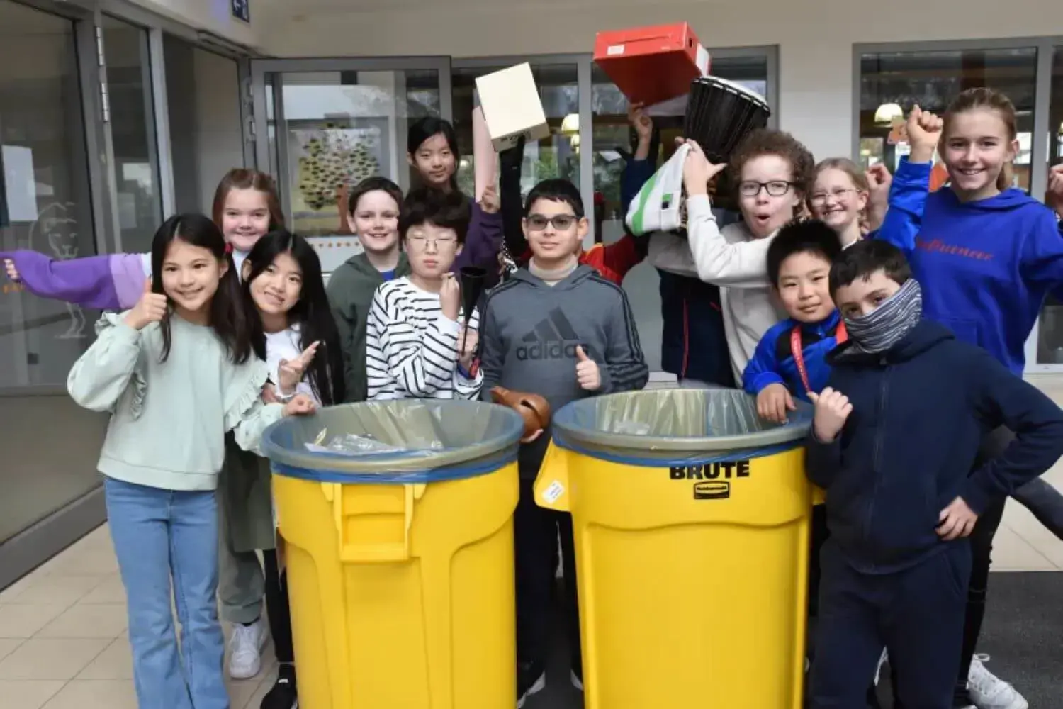 ISD Students happily posing for Yellow Bin Pick-Up Time